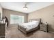 Comfortable bedroom showcasing neutral tones, a plush bed, and matching nightstands for a relaxing atmosphere at 10816 W Nosean Rd, Peoria, AZ 85383