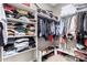 Walk-in closet with built-in shelving, hanging rods, and space for shoes at 10816 W Nosean Rd, Peoria, AZ 85383