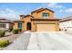 Charming two-story home featuring a terracotta roof, yellow stucco, and a two-car garage at 10816 W Nosean Rd, Peoria, AZ 85383