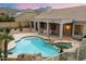 Backyard featuring a pool with rock features, a patio, and mountain views at 11322 N 118Th Way, Scottsdale, AZ 85259