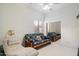 Neutral-colored bedroom with futon, armchair, and mirrored closet at 11322 N 118Th Way, Scottsdale, AZ 85259