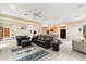 Bright living room features neutral tile flooring and flows into an open kitchen concept at 11322 N 118Th Way, Scottsdale, AZ 85259