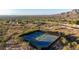 Panoramic aerial view of the community tennis courts with stunning desert mountain backdrop at 11496 E Pine Valley Rd, Scottsdale, AZ 85255