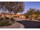 Well-maintained home exterior with mature trees and desert landscaping at 11496 E Pine Valley Rd, Scottsdale, AZ 85255