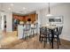 Eat-in kitchen featuring tile flooring, wooden cabinets, and stainless steel appliances at 11496 E Pine Valley Rd, Scottsdale, AZ 85255