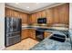 Well-equipped kitchen showcasing stone countertops, tile backsplash, and stainless steel appliances at 11496 E Pine Valley Rd, Scottsdale, AZ 85255