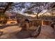 Outdoor kitchen with built-in grill and countertops, plus fire pit and mountain views at 11496 E Pine Valley Rd, Scottsdale, AZ 85255