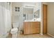 Bright bathroom featuring tile floors, a wood vanity, a large mirror and good lighting at 11640 N Tatum Blvd # 1052, Phoenix, AZ 85028