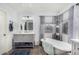 Classic bathroom featuring a clawfoot tub, marble countertops, and updated fixtures at 1252 N Jackson St, Gilbert, AZ 85233