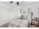 Cozy bedroom featuring a ceiling fan, soft lighting, and a closet at 1252 N Jackson St, Gilbert, AZ 85233