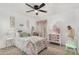 Charming bedroom with soft lighting, ceiling fan, and decorative accents at 1252 N Jackson St, Gilbert, AZ 85233