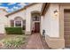 Charming front door entrance with brick pathway, decorative plants, and stylish light fixture at 1252 N Jackson St, Gilbert, AZ 85233