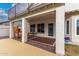 Covered patio with brick flooring, outdoor furniture, offering a relaxing view of the backyard at 1252 N Jackson St, Gilbert, AZ 85233