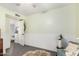 Bright and airy sitting room with chair, rug, and wainscoting detail at 1252 N Jackson St, Gilbert, AZ 85233