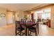 Inviting dining area with seating for six, adjacent to the living room and kitchen at 13070 W Eagle Talon Trl, Peoria, AZ 85383