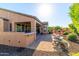 View of outdoor bar and kitchen area that leads to a backyard patio and firepit at 13070 W Eagle Talon Trl, Peoria, AZ 85383