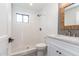 Updated bathroom with glass shower, stylish vanity, and modern fixtures at 1327 W Glendale Ave, Phoenix, AZ 85021