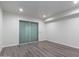 Bedroom featuring wood-look flooring and a sliding glass door to the outside at 1327 W Glendale Ave, Phoenix, AZ 85021