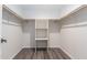 Bright walk-in closet with built-in shelving and laminate flooring at 1327 W Glendale Ave, Phoenix, AZ 85021