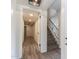 Hallway with wood-look flooring leading to staircase at 1327 W Glendale Ave, Phoenix, AZ 85021