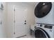 Well-organized laundry room featuring modern washer and dryer appliances, plus a utility sink at 1327 W Glendale Ave, Phoenix, AZ 85021