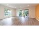 Bright and airy living area featuring modern flooring and sliding glass doors to the outdoor patio at 1327 W Glendale Ave, Phoenix, AZ 85021