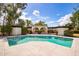 Inviting backyard pool with surrounding trees and classic architecture, perfect for summer at 1327 W Glendale Ave, Phoenix, AZ 85021