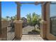 Private balcony with wrought-iron railing offers views of landscaped community and blue skies at 14250 W Wigwam Blvd # 1022, Litchfield Park, AZ 85340