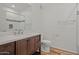 Modern bathroom featuring a wood vanity with marble countertop and walk-in shower at 14250 W Wigwam Blvd # 1022, Litchfield Park, AZ 85340