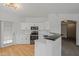 Bright kitchen featuring stainless steel appliances, white cabinetry, and light-colored wood floors at 14250 W Wigwam Blvd # 1022, Litchfield Park, AZ 85340