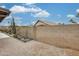 Backyard featuring desert landscaping, gravel and block wall fence at 14458 W Powderhorn Dr, Surprise, AZ 85374