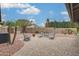 Charming backyard patio area with comfortable seating and mature landscaping at 14458 W Powderhorn Dr, Surprise, AZ 85374