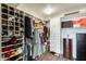 A well-organized closet with shelving, rods, and drawers for optimal storage solutions at 14458 W Powderhorn Dr, Surprise, AZ 85374