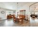 Warm dining room features wood furniture, natural light, and a welcoming ambiance for Gathering gatherings at 14458 W Powderhorn Dr, Surprise, AZ 85374