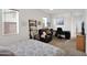 Inviting bedroom featuring a reading nook with a dark recliner and a dedicated workspace at 1454 E Flower St, Phoenix, AZ 85014