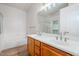 Bathroom with a double sink vanity and a separate tub and shower at 15853 N 74Th Ave, Peoria, AZ 85382