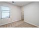 This bedroom features neutral carpeting and a window with blinds at 15853 N 74Th Ave, Peoria, AZ 85382