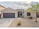 Charming single-story home with a two-car garage and desert landscaping at 15853 N 74Th Ave, Peoria, AZ 85382