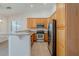 Kitchen with stainless steel appliances and light wood cabinets at 15853 N 74Th Ave, Peoria, AZ 85382