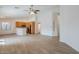 Open concept living space with hardwood floors that leads to the kitchen at 15853 N 74Th Ave, Peoria, AZ 85382