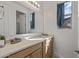 Well-lit bathroom featuring a wide mirror, a vanity with ample storage, and bright neutral walls at 1627 E Walter Dr, Casa Grande, AZ 85122