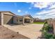 A view of the covered patio and large backyard with desert landscaping at 1627 E Walter Dr, Casa Grande, AZ 85122