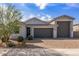 Charming single-story home with a three-car garage and a desert-landscaped front yard at 1627 E Walter Dr, Casa Grande, AZ 85122