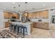 A bright kitchen featuring a large center island, stainless steel appliances, and ample cabinet space at 1627 E Walter Dr, Casa Grande, AZ 85122