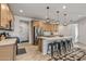 A bright kitchen featuring a large center island, stainless steel appliances, and ample cabinet space at 1627 E Walter Dr, Casa Grande, AZ 85122