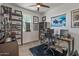 Inviting home office featuring sleek desk, modern shelves, and a bright window view at 1627 E Walter Dr, Casa Grande, AZ 85122