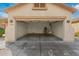 Spacious garage with access door and utilities at 17125 W Saguaro Ln, Surprise, AZ 85388