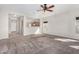 Spacious living room with carpet, natural light, and an open floor plan creating an airy feel at 17125 W Saguaro Ln, Surprise, AZ 85388