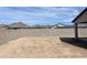 Large backyard with a block wall, providing privacy and space for outdoor activities at 17216 W Sunward Dr, Goodyear, AZ 85338