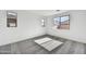 Cozy bedroom featuring carpeted floors and bright windows at 17216 W Sunward Dr, Goodyear, AZ 85338